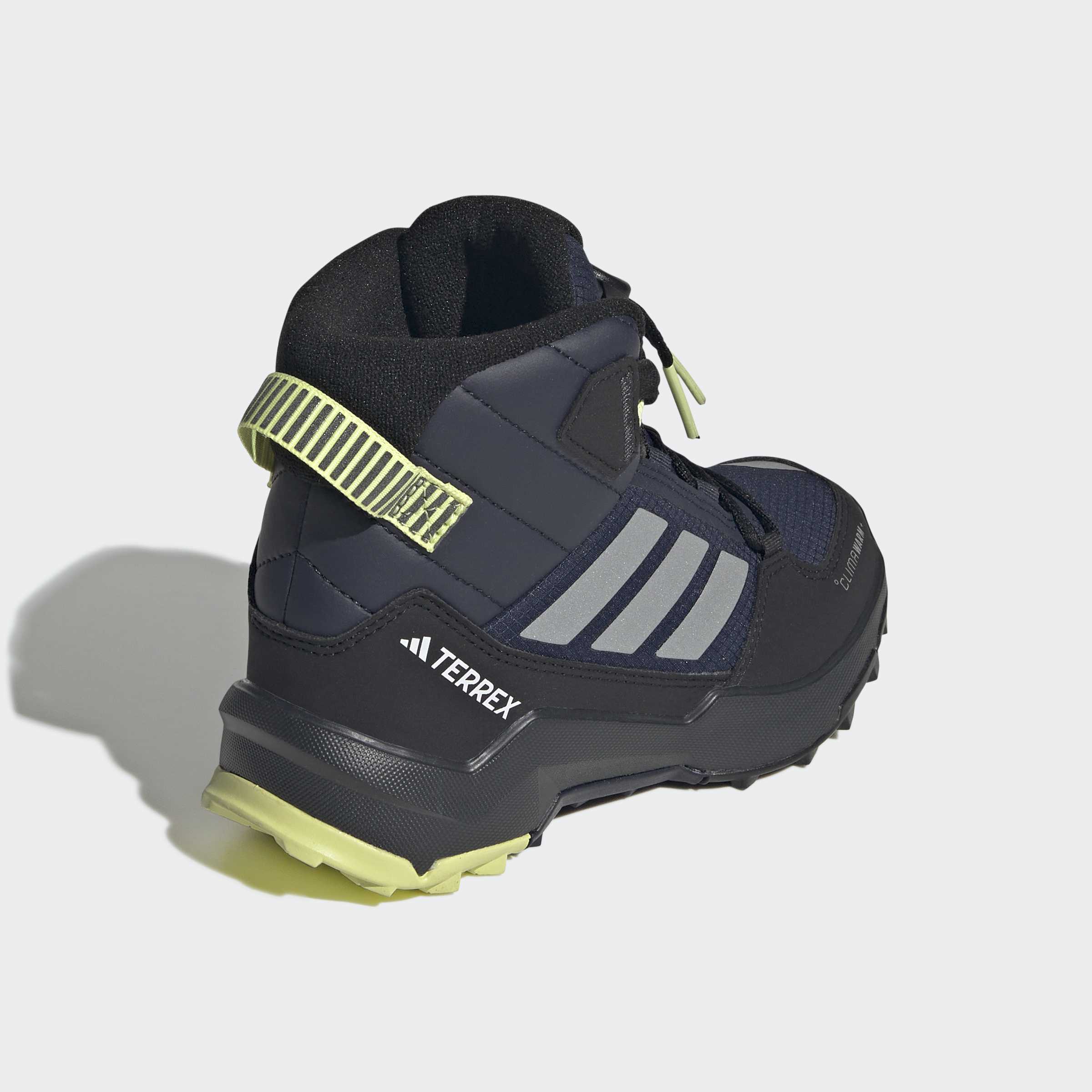 Детски обувки adidas Terrex AX4R Mid с подплатена зона около глезена, лого TERREX и светлозелена примка на петата