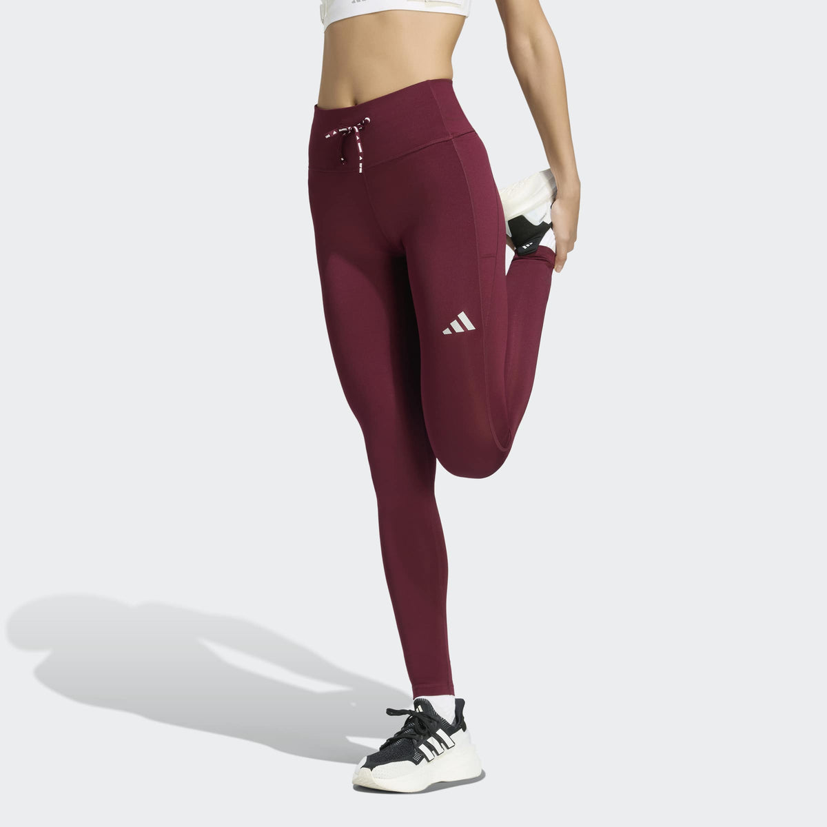 Дамски клин за бягане adidas Run Essentials KQ8195 – изглед върху модел с висока регулируема талия и лого adidas